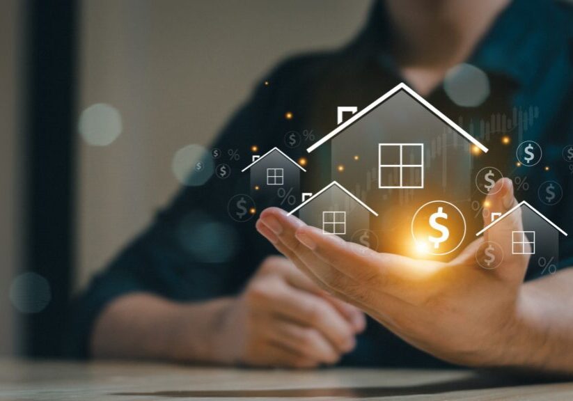 Hand holding digital house with dollar symbol.